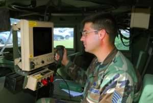 A U.S. soldier remotely operates a CROWS weapon station